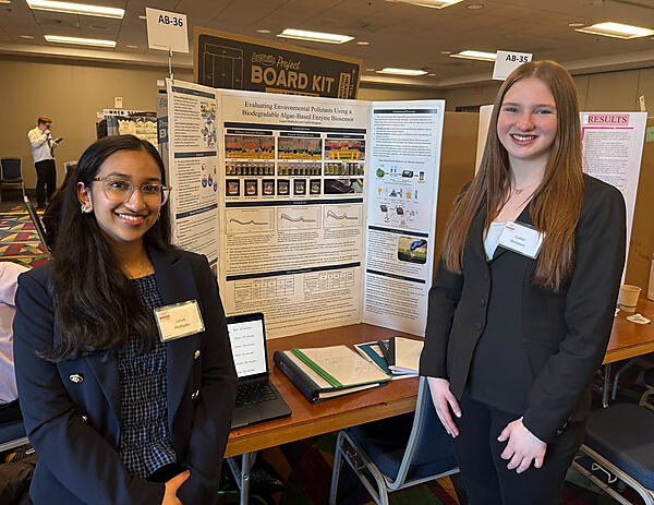 Juniors Lasya Muthyala, left, and Caitlin Stimpson won a first place award and the AMS Microbiology Award for their project, “Evaluating Environmental Pollutants Using a Biodegradable Algae-Based Enzyme Biosensor.” (Photo Courtesy Littleton Public Schools)