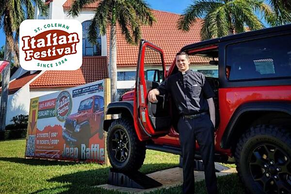 Fr. Michael with the Jeep being raffled at the festival!