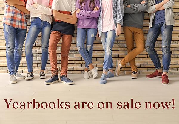 photo of students' legs and text "Yearbooks on sale now"