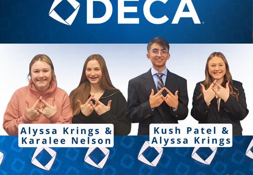 four students hold up the DECA symbol