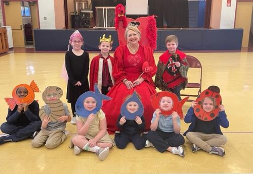 Queen of Hearts with students