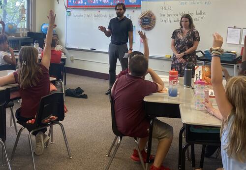 Dr. Shaughnessy and Counselor Chalus speak to a class