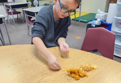 Students developing their motor skills in the classroom