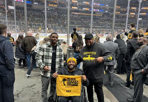 Kevin Clarke and Olando Dulin pose with Leon Ford at Pens game