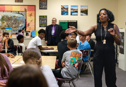 High school teachers speak to new students