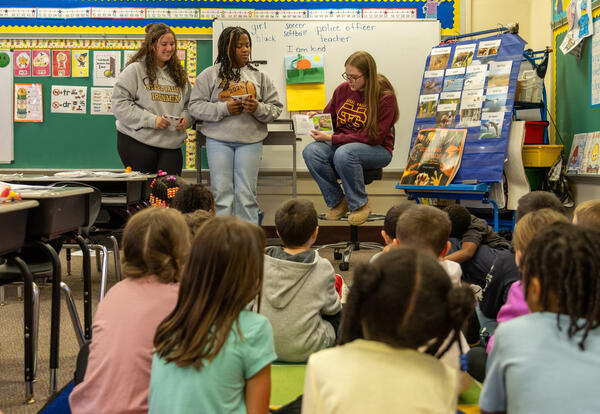 HS students read to elementary students