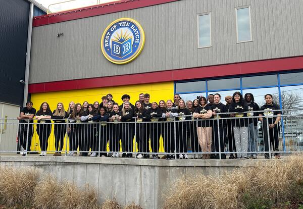 Students stand in front of Best of the Batch Foundation