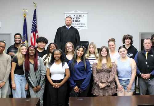 Participants in the mock trial pose for a photo