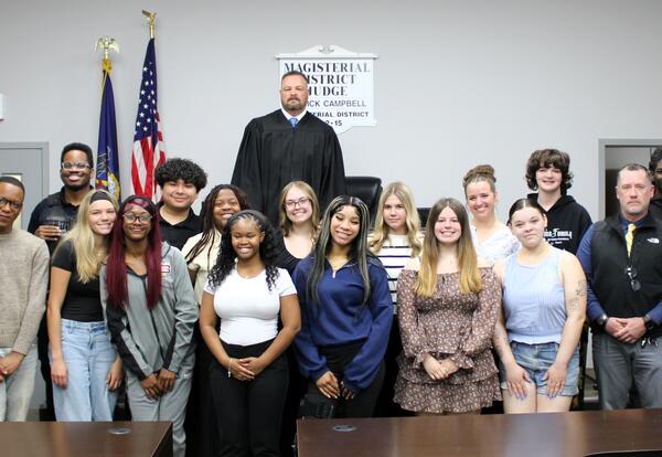 Participants in the mock trial pose for a photo