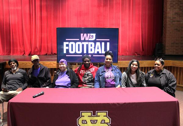 Randall with family during signing