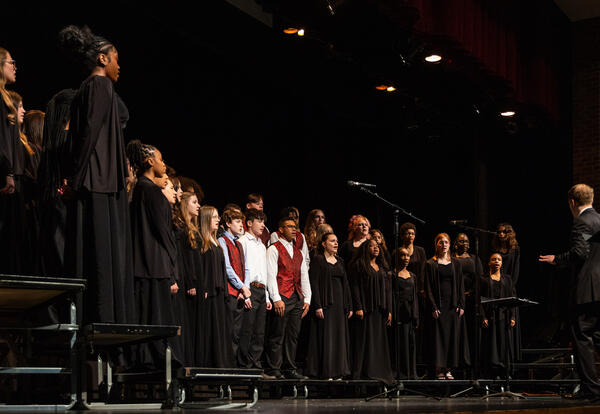 The high school concert choir performs