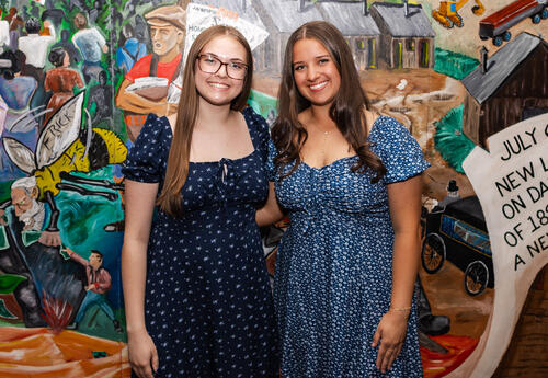 The valedictorian and salutatorian pose for a photo