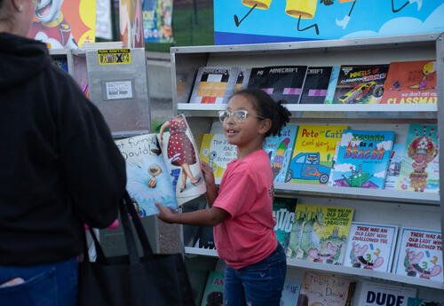 A student shops at a book fair
