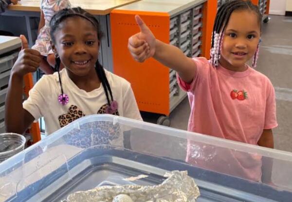 Students give a thumbs up