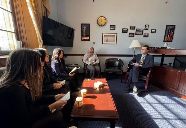 Students talking to policy aide