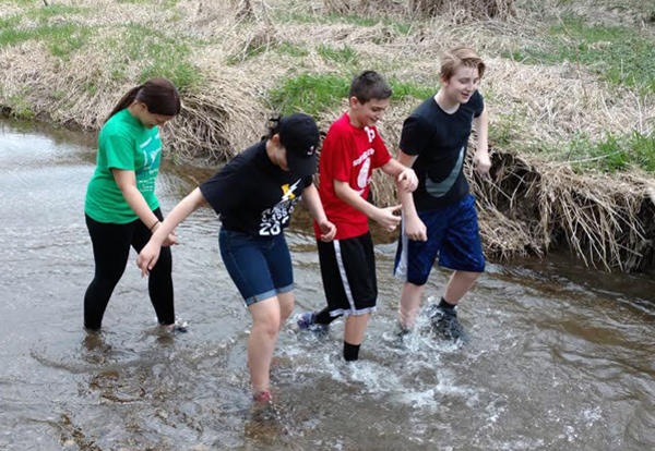 D140 Students Release Trout into Kinnikinnick Creek