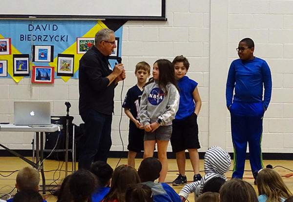 author David Biedrzycki with students