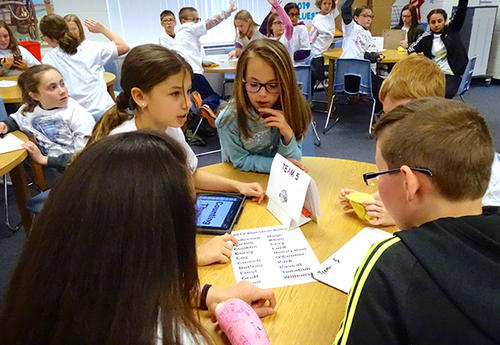 students working together to solve quiz questions