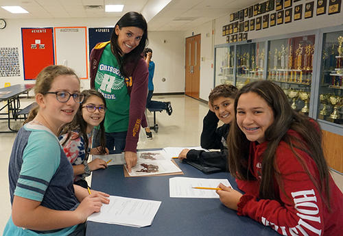 teacher with four students