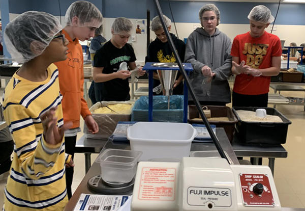 students packing boxes