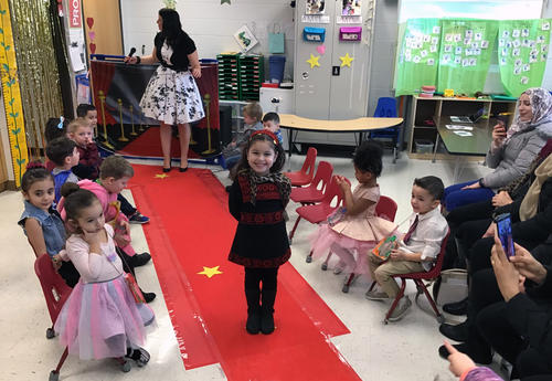 student posing on the red carpet