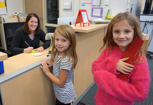 media center director and two smiling students