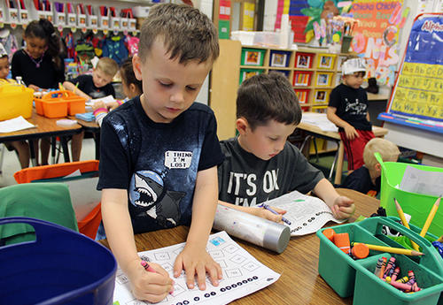 kindergarten students working in classroom