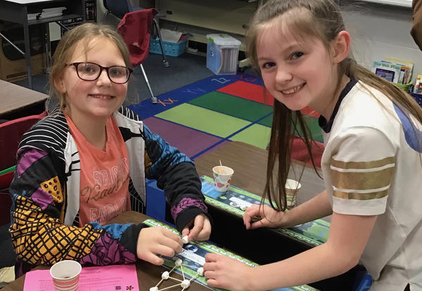 two smiling students at STEAM night