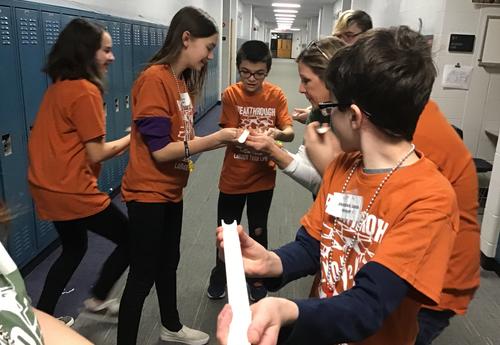 smiling students participating in group activity