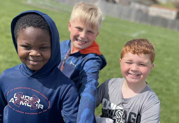 Students smiling outside