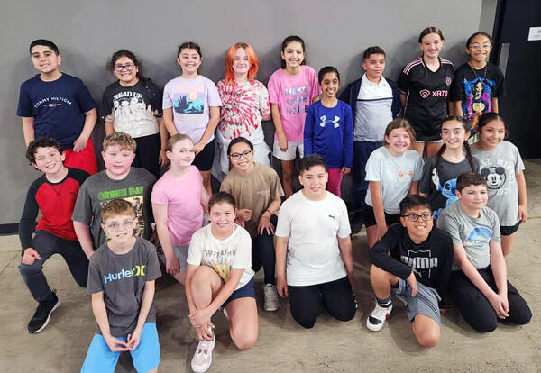 Group of fifth grade students pose for a picture