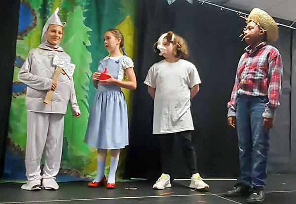 Students on stage during Wizard of Oz performance