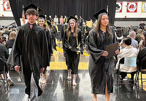 PV graduates walking down aisle after graduation