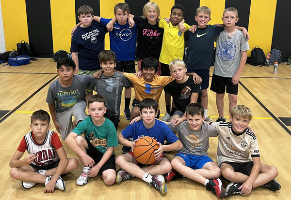 Boys fifth-grade basketball team poses for group pictures before season starts