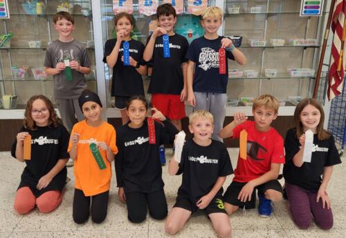 Students pose proudly with ribbons won for annual ghostbuster race