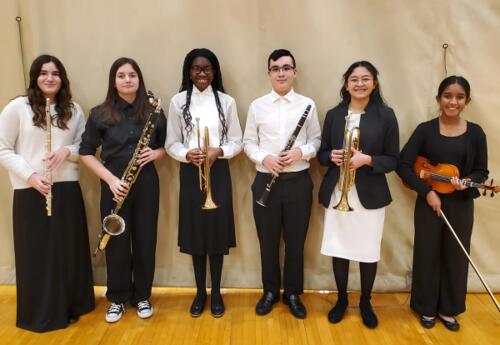 Band members pose proudly at  the Illinois Music Education Association (ILMEA) Band Festival