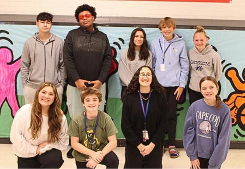 Grissom’s Eighth-Grade Advisory Committee pose proudly after fundraiser in hallway