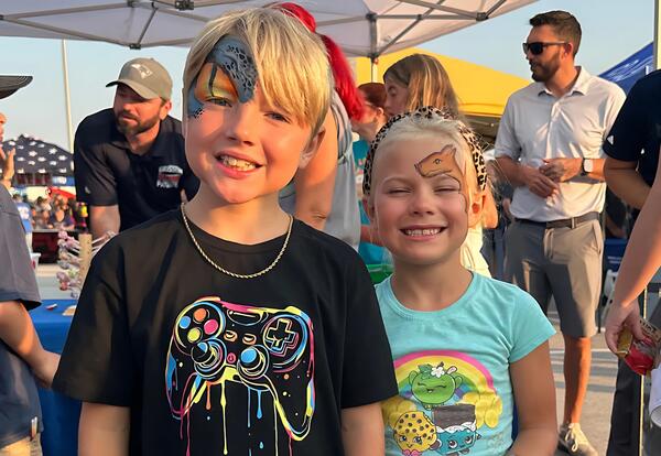 Students smile with their faces painted at Tinley Park' s National Night Out