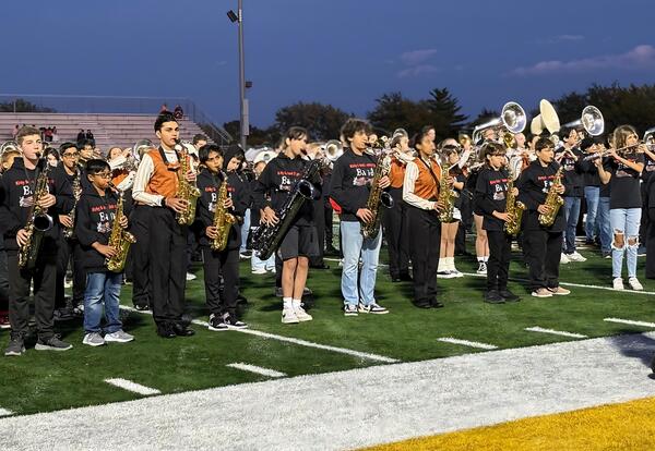 D140 and VJA Marching band perfoming pregame show on football field