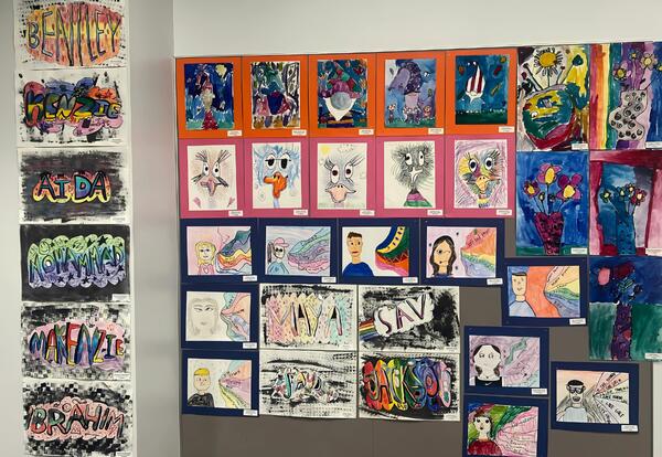 McAuliffe student artwork hanging on the wall in the board room at the administration center