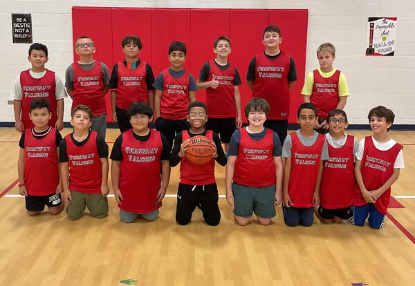 Fernway fifth grade boys' basketball team poses proudly in school gym after practice