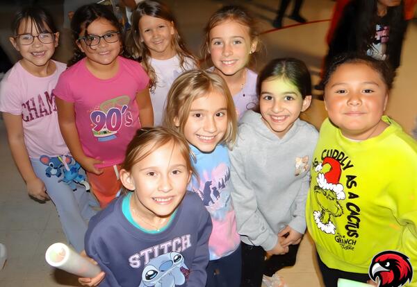 Group of girls pose proudly during PBIS celebration