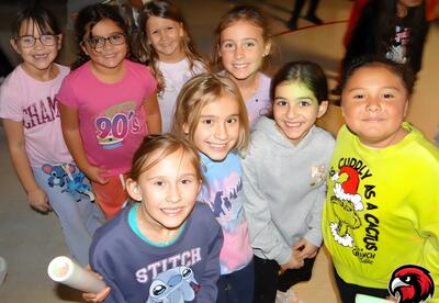 Group of girls pose proudly during PBIS celebration