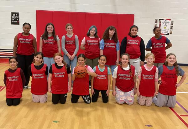 Fernway fifth-grade girls' basketball team pose proudly in gym after practice