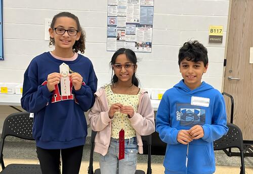 Millennium's top three Spelling Bee winners pose proudly with ribbons