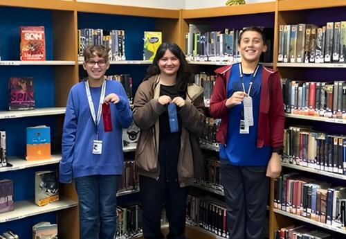Grissom's top three Spelling Bee winners pose proudly with ribbons