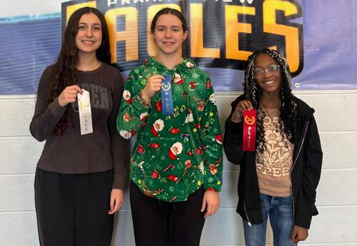 Prairie View's top three Spelling Bee winners pose proudly with ribbons