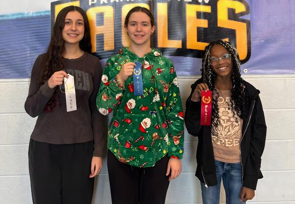 Prairie View's top three Spelling Bee winners pose proudly with ribbons