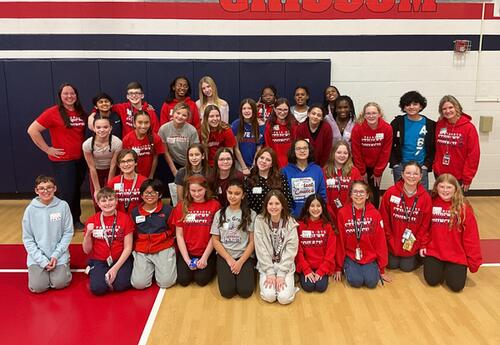 Grissom Student Council members and faculty sponsors pose proudly in school gym