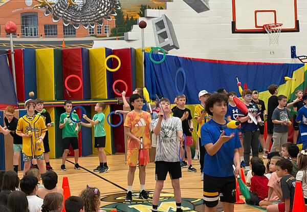 Millennium students juggling in the gym during Juggling Show
